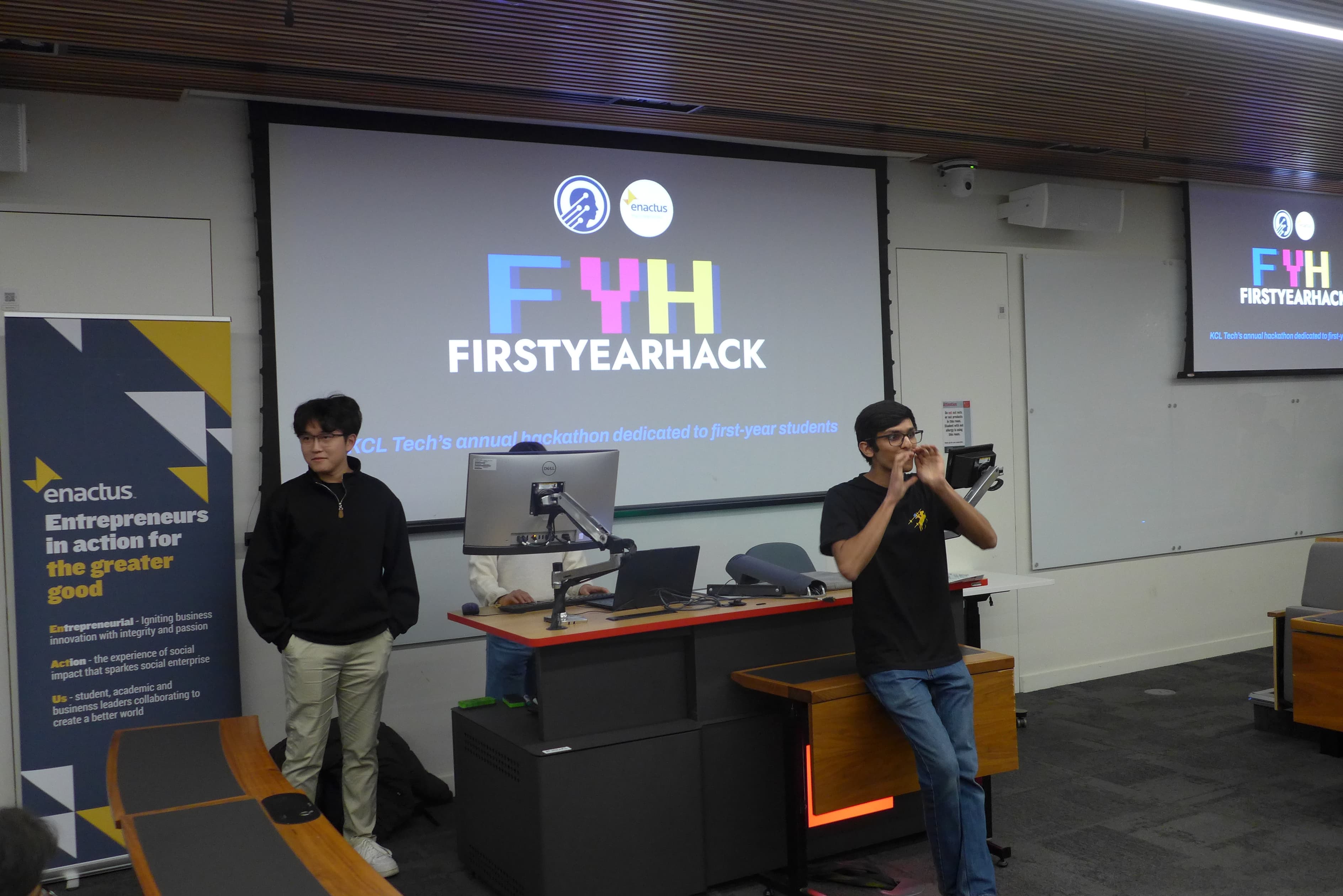 Students presenting at FirstYearHack in a lecture theatre